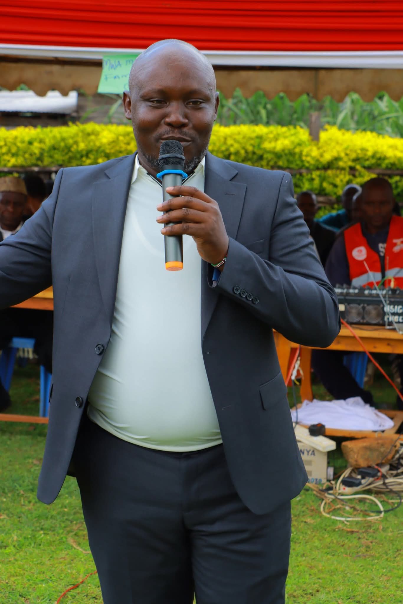 Dr. Birundu speaking to residents at a community gathering